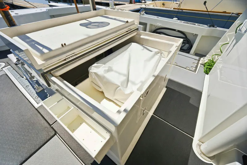 Slide: The Image of Open storage compartment on a 2018 Dixon 55 yacht deck, showcasing interior space. - 65