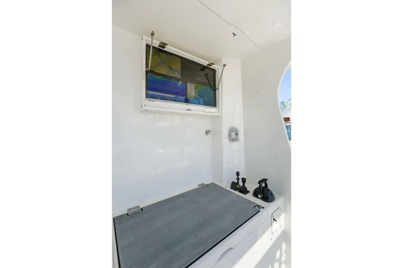 Slide: The Image of Interior of 2018 Dixon 55 boat with navigation equipment and control panel. - 57