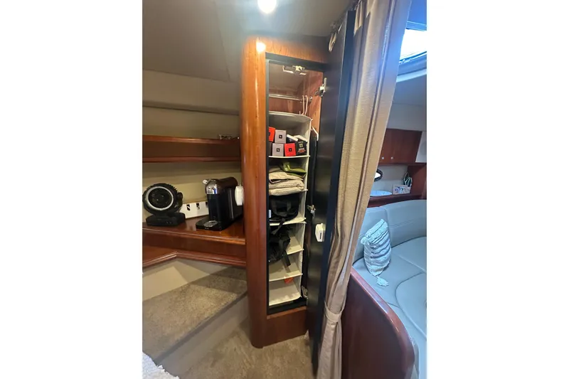Slide: The Image of Interior of 2006 Cruisers Yachts 370 Express with storage and seating area. - 38