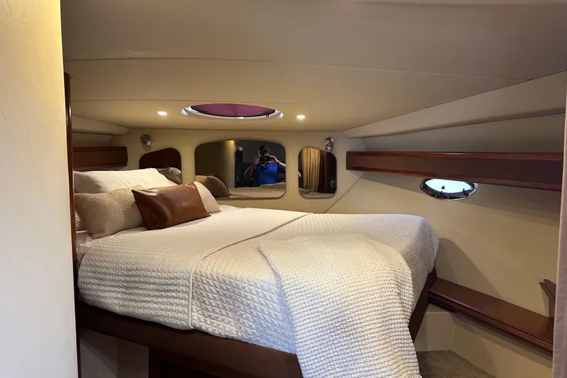 Slide: The Image of Luxurious cabin interior of 2006 Cruisers Yachts 370 Express with cozy bedding. - 33