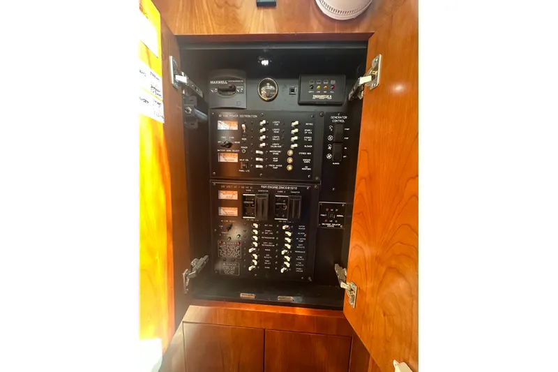 Slide: The Image of Electrical panel inside 2006 Cruisers Yachts 370 Express, showcasing switches and controls. - 39