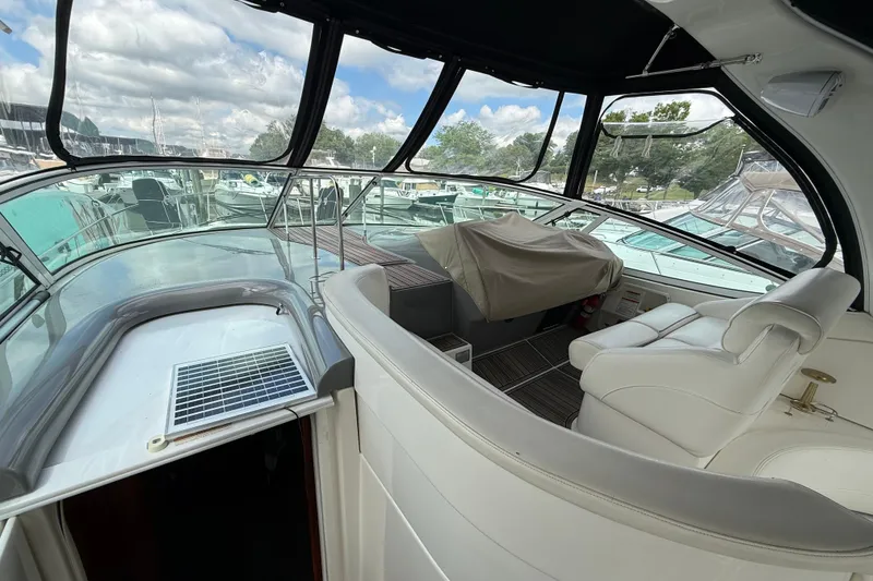 Slide: The Image of Interior view of 2006 Cruisers Yachts 370 Express, featuring helm and seating area. - 8