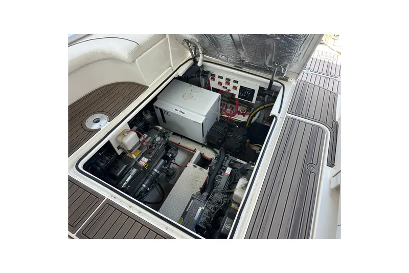 Slide: The Image of Engine compartment of 2006 Cruisers Yachts 370 Express, showcasing mechanical components and wiring. - 20