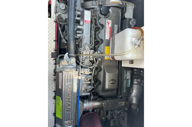 Slide: The Image of Engine of a 2006 Cruisers Yachts 370 Express, featuring Yanmar diesel components. - 45