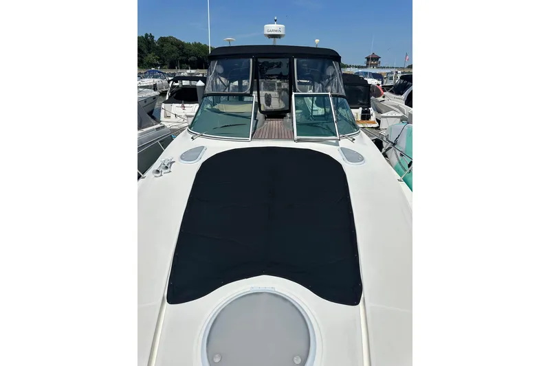 Slide: The Image of 2006 Cruisers Yachts 370 Express docked at marina, front deck view. - 5
