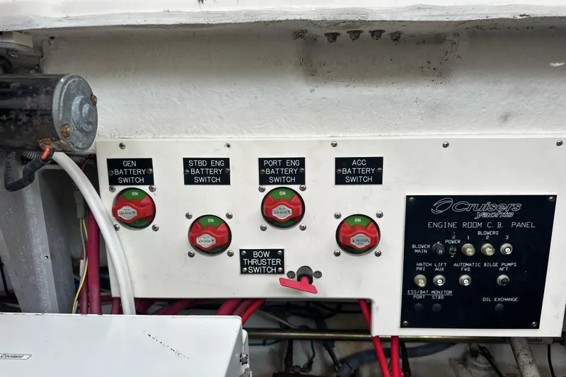 Slide: The Image of Control panel of a 2006 Cruisers Yachts 370 Express with battery switches and indicators. - 43