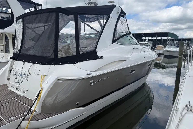 Slide: The Image of 2006 Cruisers Yachts 370 Express docked, featuring sleek design and enclosed cockpit. - 3