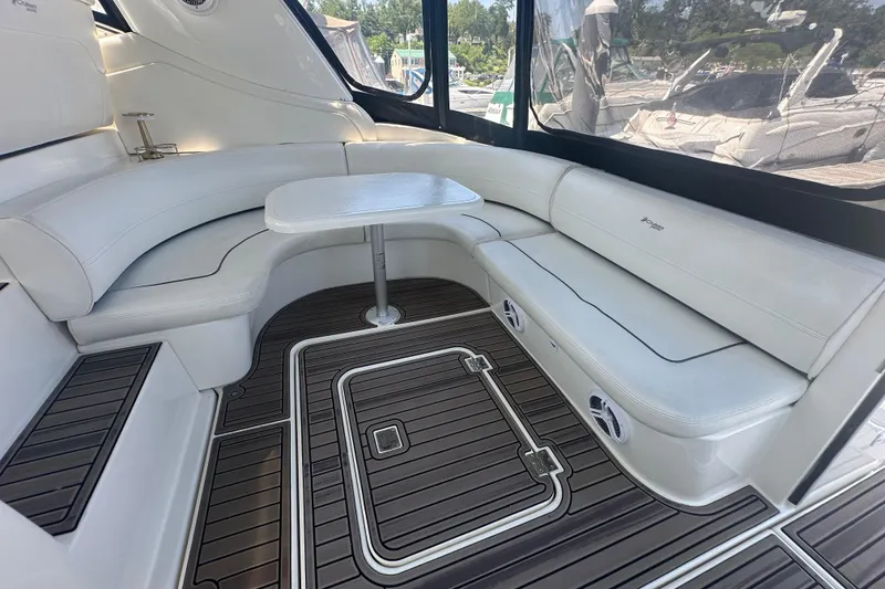 Slide: The Image of Luxurious 2006 Cruisers Yachts 370 Express interior with white seating and sleek wood flooring. - 16