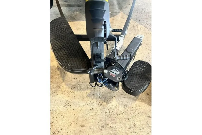 Slide: The Image of Close-up of 2026 Ranger Z518 Cup-Equipped boat pedal controls on concrete surface. - 8