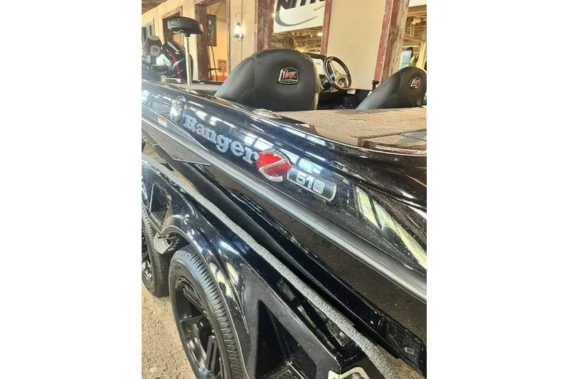 Slide: The Image of 2026 Ranger Z518 Cup-Equipped boat, sleek black design, interior view. - 4