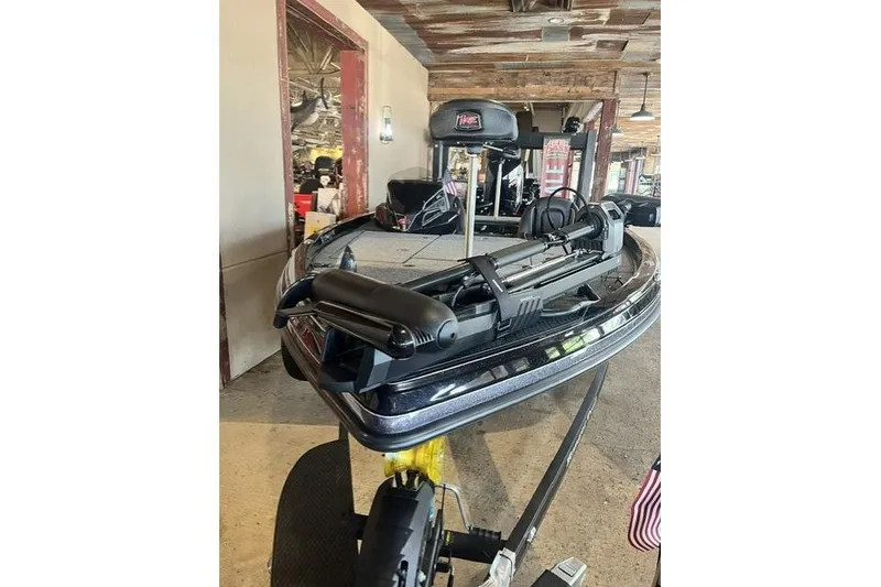 Slide: The Image of 2026 Ranger Z518 Cup-Equipped boat displayed indoors, showcasing sleek design and advanced features. - 2