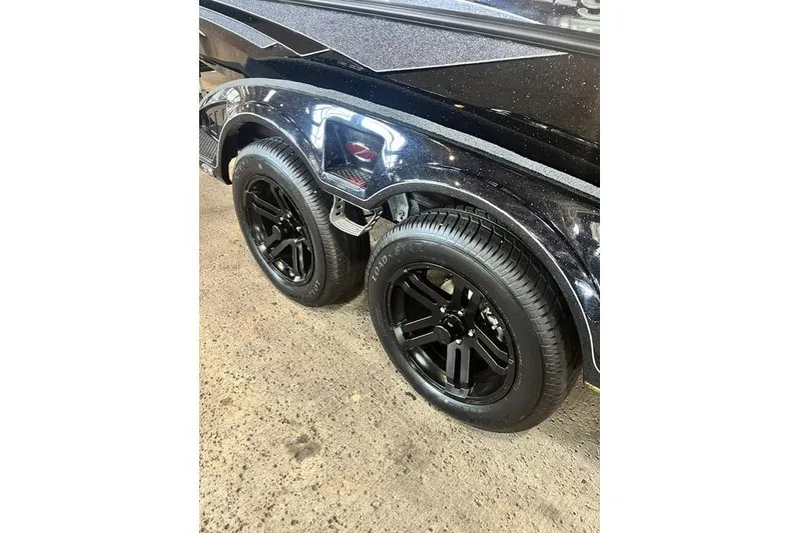 Slide: The Image of 2026 Ranger Z518 Cup-Equipped trailer with sleek black wheels on a concrete surface. - 12