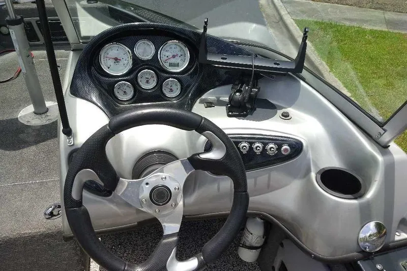 Slide: The Image of Steering console of 2015 Tracker Targa V-18 WT boat with gauges and controls. - 3