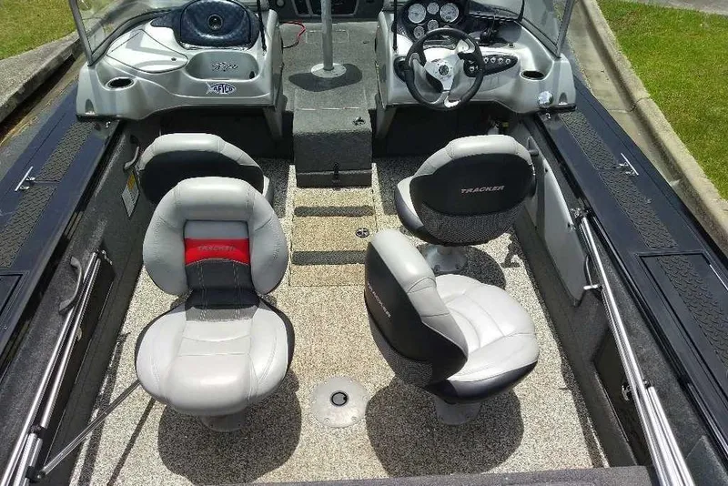 Slide: The Image of 2015 Tracker Targa V-18 WT boat interior with four seats and steering console. - 4