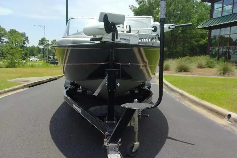 Slide: The Image of 2015 Tracker Targa V-18 WT boat on trailer, parked outdoors. - 7