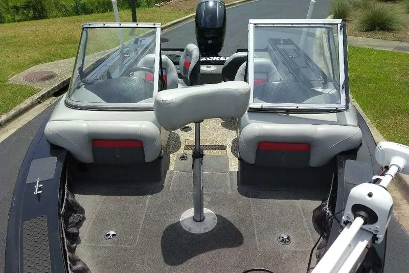 Slide: The Image of 2015 Tracker Targa V-18 WT boat interior with seating and windshield. - 12