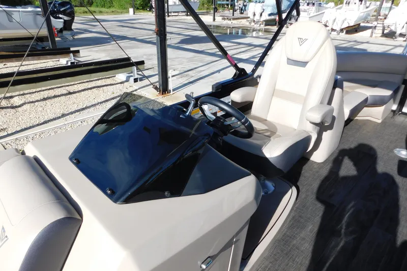 Slide: The Image of 2023 Viaggio Diamante U 26 boat interior with steering wheel and captain's chair. - 15