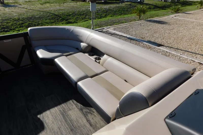 Slide: The Image of Luxurious seating on 2023 Viaggio Diamante U 26 pontoon boat, featuring plush beige upholstery. - 32