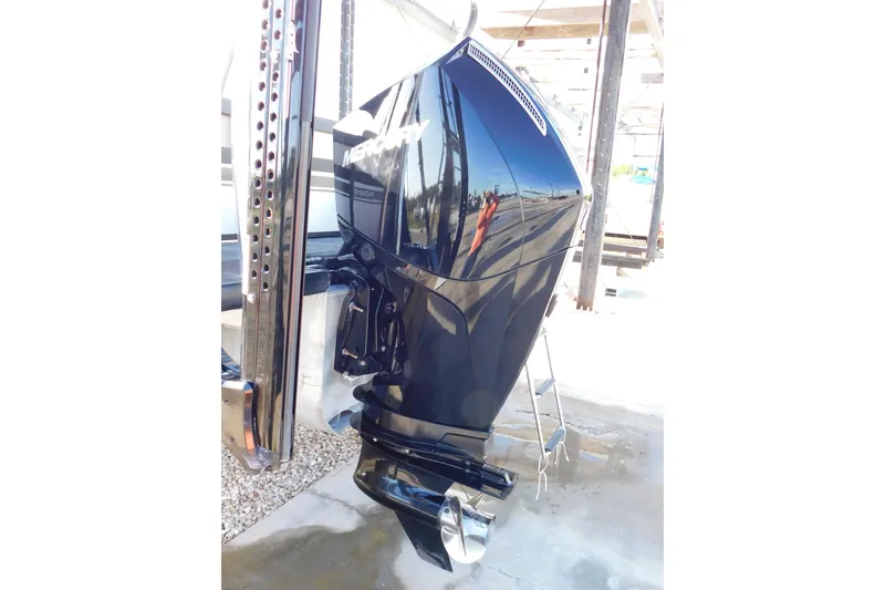 Slide: The Image of 2023 Viaggio Diamante U 26 boat with Mercury outboard motor, docked outdoors. - 12
