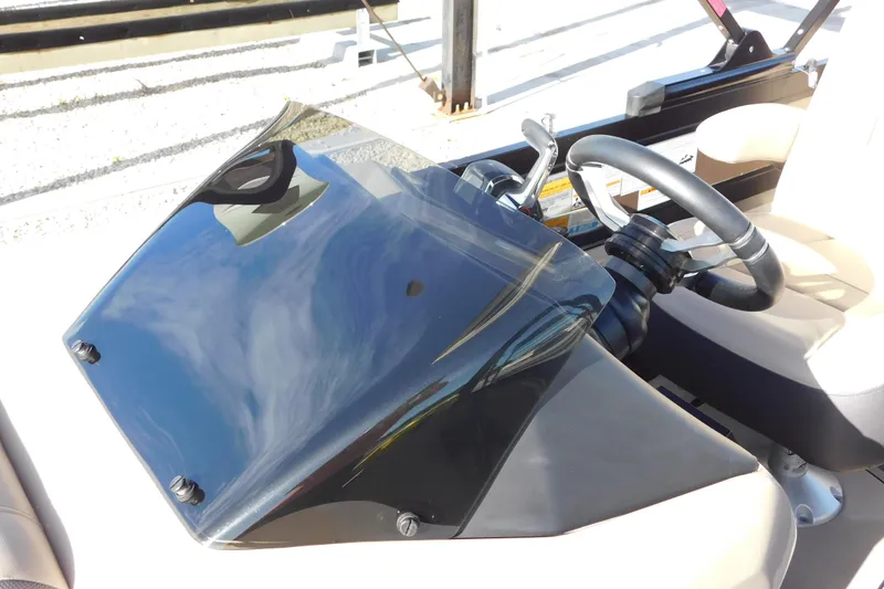 Slide: The Image of Steering console of 2023 Viaggio Diamante U 26 boat with sleek black windshield. - 19