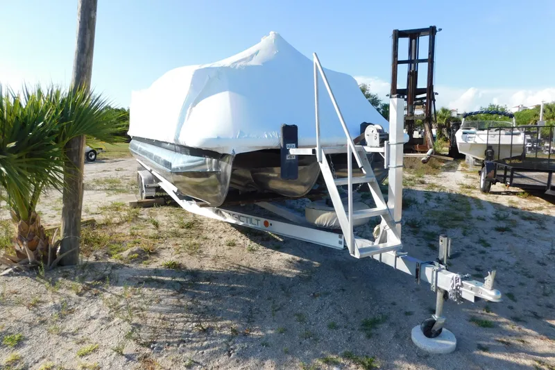 Slide: The Image of 2023 Viaggio Diamante U 26 boat covered on trailer, parked outdoors. - 6