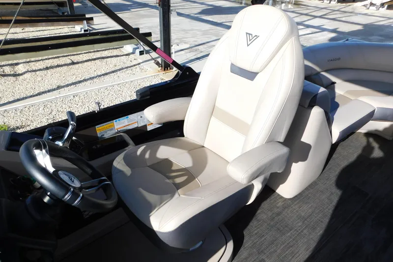 Slide: The Image of Captain's seat of 2023 Viaggio Diamante U 26 boat, featuring luxurious beige upholstery. - 16