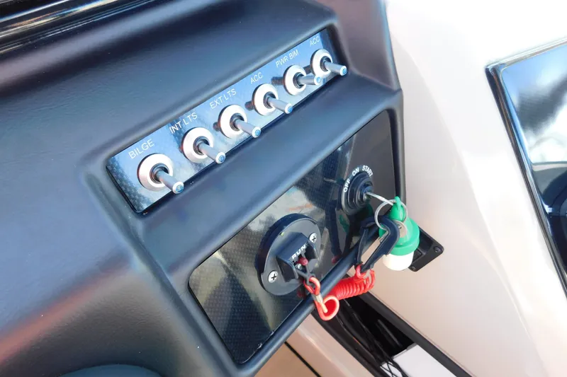 Slide: The Image of Control panel of 2023 Viaggio Diamante U 26 boat with switches and ignition key. - 24