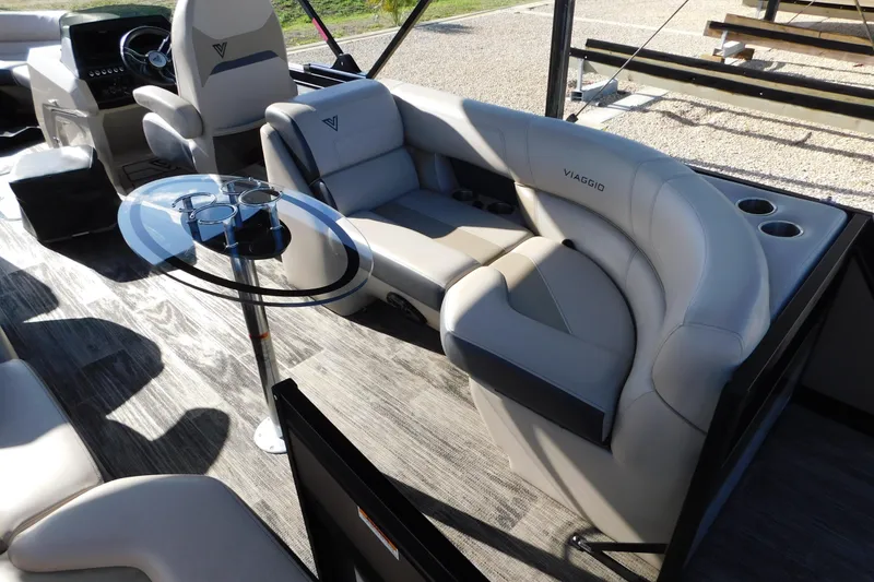 Slide: The Image of Luxurious interior of 2023 Viaggio Diamante U 26 pontoon boat with plush seating and table. - 26