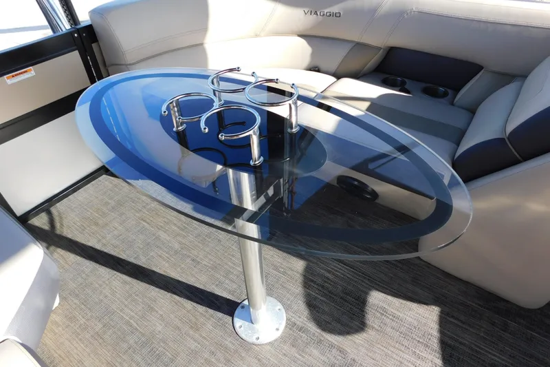 Slide: The Image of Luxurious Viaggio Diamante U 26 boat interior with sleek glass table and cup holders, 2023 model. - 28