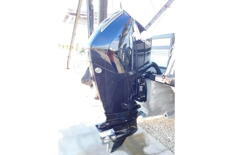 Slide: The Image of 2023 Viaggio Diamante U 26 boat with a sleek black Mercury outboard motor. - 11