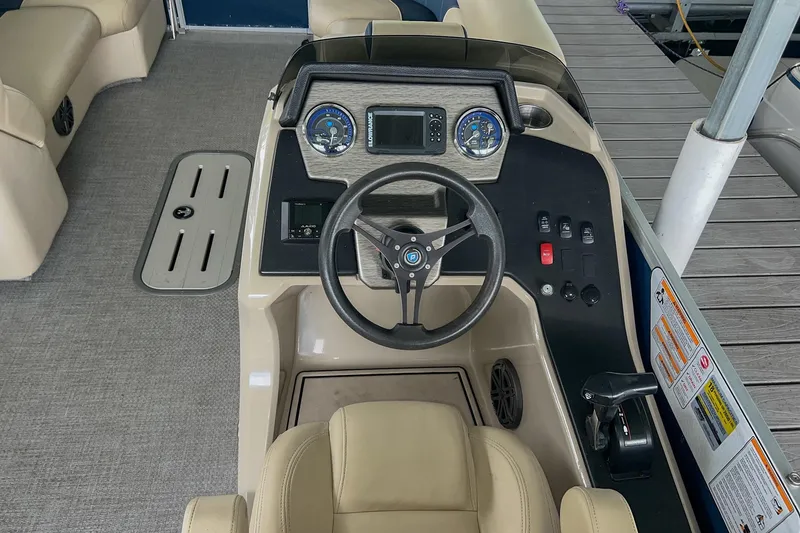 Slide: The Image of Cockpit of 2020 Premier 230 Sunsation pontoon boat with steering wheel and control panel. - 34