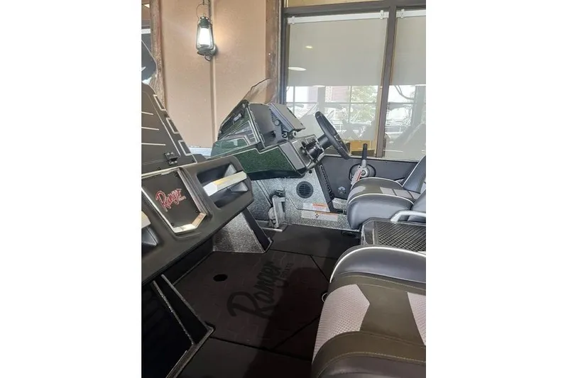 Slide: The Image of 2026 Ranger Z520 boat interior with modern dashboard and seating. - 5