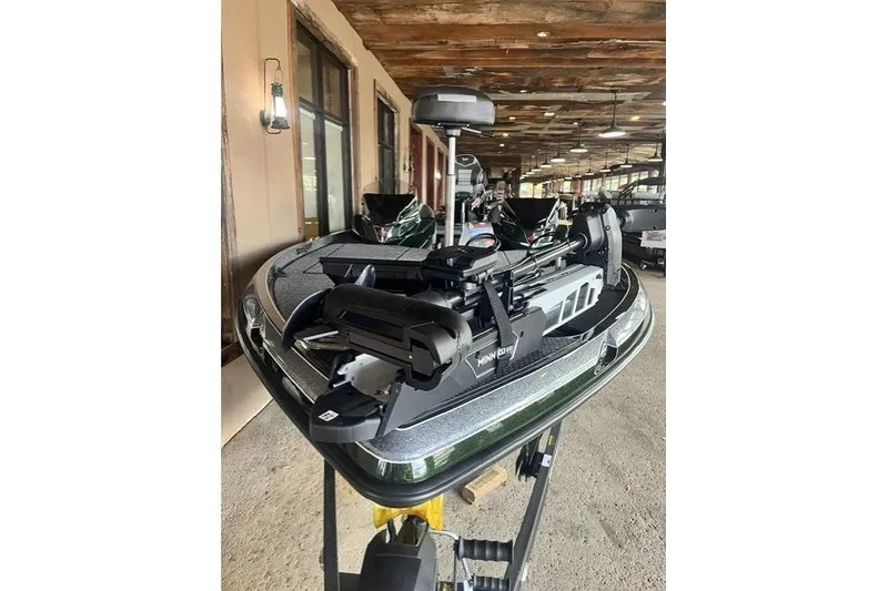 Slide: The Image of 2026 Ranger Z520 boat with advanced trolling motor in a showroom setting. - 3