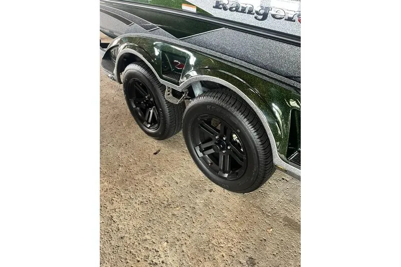 Slide: The Image of 2026 Ranger Z520 trailer with black wheels on a concrete surface. - 10