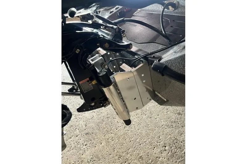 Slide: The Image of 2026 Ranger Z520 boat engine mount detail on concrete surface. - 11