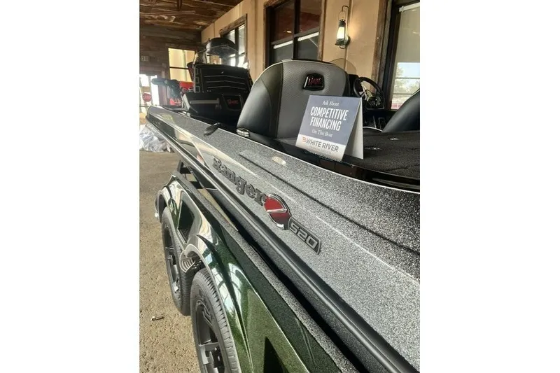 Slide: The Image of 2026 Ranger Z520 boat with competitive financing sign at dealership. - 8