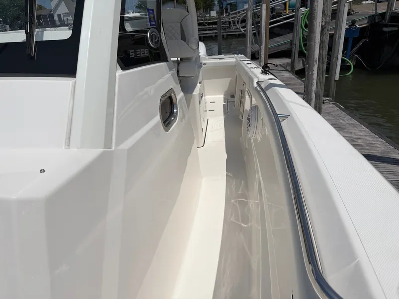 Slide: The Image of The 2025 Pursuit S 328 Sport features a sleek white hull and modern design. - 27