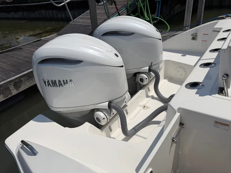 Slide: The Image of Two Yamaha outboard engines are mounted on the stern of a Pursuit S 328 Sport boat. - 29