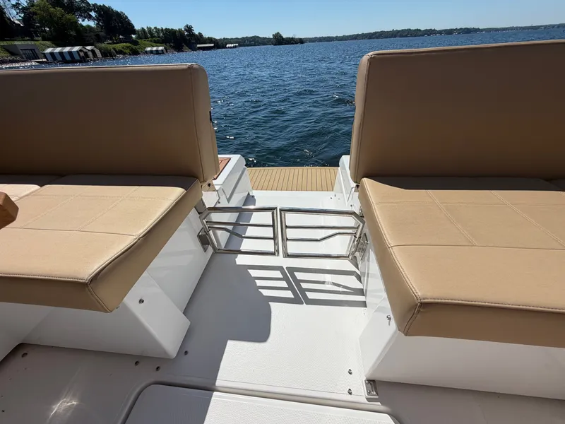 Slide: The Image of The 2015 Cruisers Yachts 390 Express Coupe features an open seating area overlooking the water. - 39
