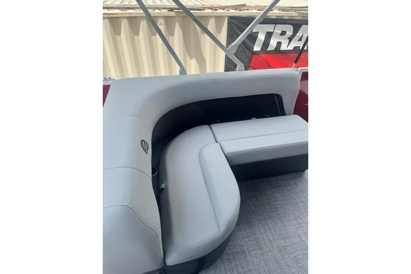 Slide: The Image of 2026 SUNTRACKER pb18 boat interior with gray cushioned seating. - 9
