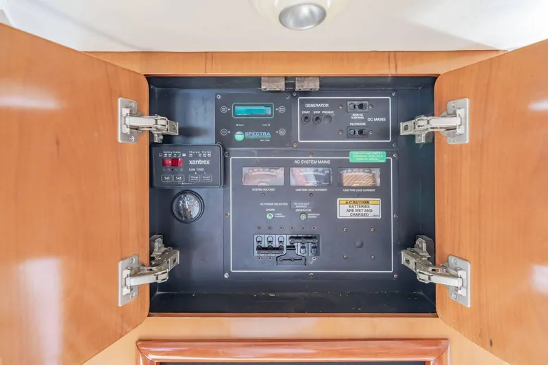 Slide: The Image of Electrical control panel inside a 2000 Carver 450 Voyager Pilothouse yacht. - 68