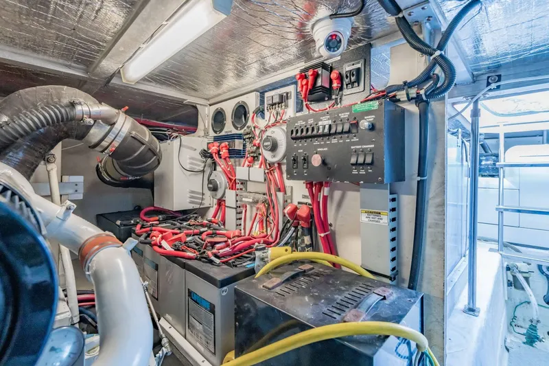 Slide: The Image of Engine room of 2000 Carver 450 Voyager Pilothouse with wiring and control panels. - 73