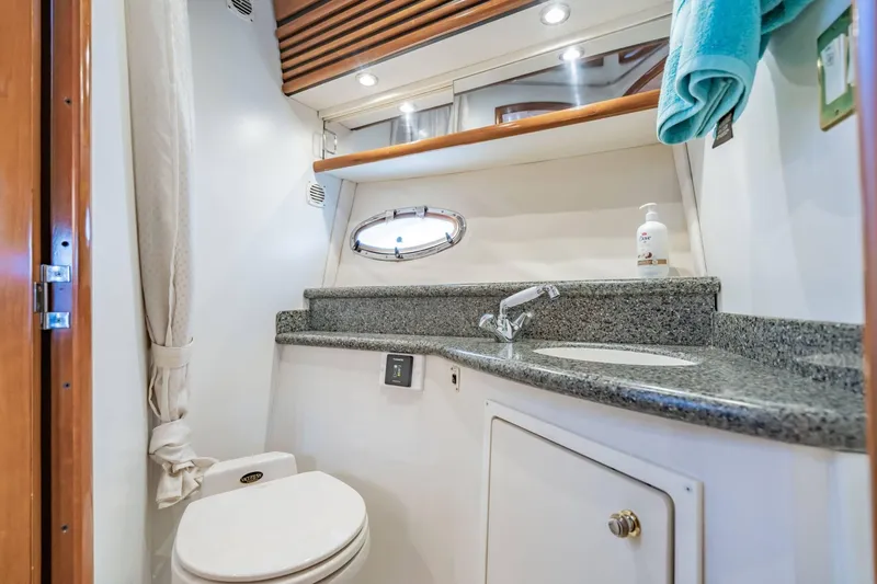 Slide: The Image of Luxurious bathroom in 2000 Carver 450 Voyager Pilothouse yacht with granite countertop. - 58