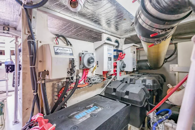 Slide: The Image of Engine room of 2000 Carver 450 Voyager Pilothouse with electrical systems and components. - 74