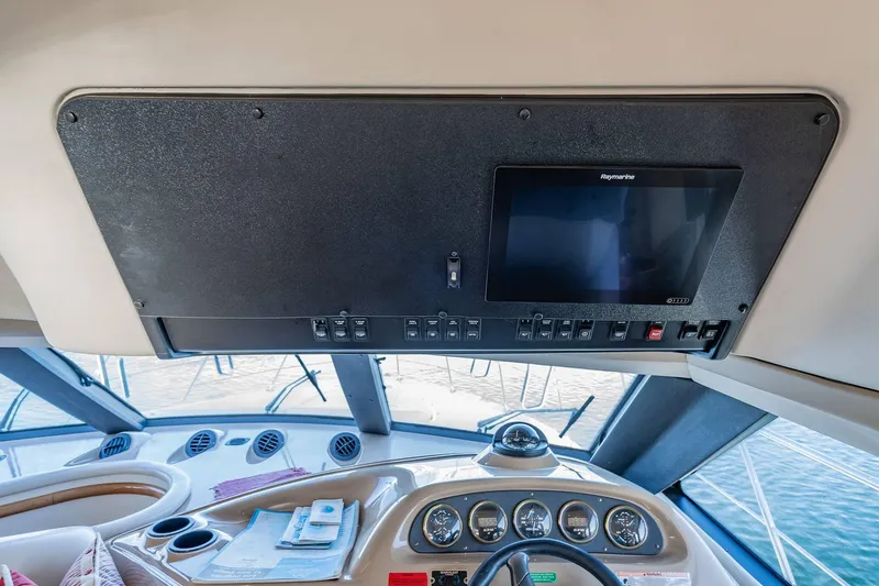 Slide: The Image of Interior helm of 2000 Carver 450 Voyager Pilothouse with navigation equipment. - 48