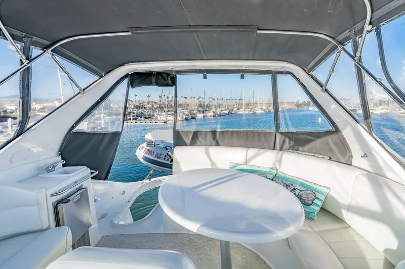 Slide: The Image of Interior of 2000 Carver 450 Voyager Pilothouse with marina view through windows. - 31