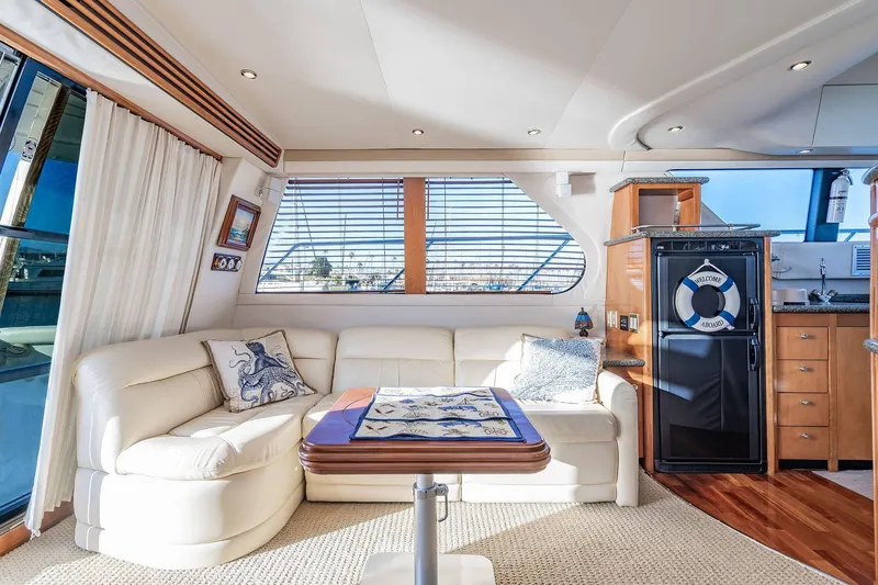 Slide: The Image of Luxurious interior of 2000 Carver 450 Voyager Pilothouse with elegant seating and nautical decor. - 37