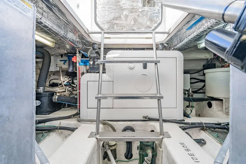 Slide: The Image of Engine room of 2000 Carver 450 Voyager Pilothouse with ladder and equipment. - 75