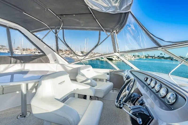 Slide: The Image of Pilothouse interior of 2000 Carver 450 Voyager with marina view. - 29