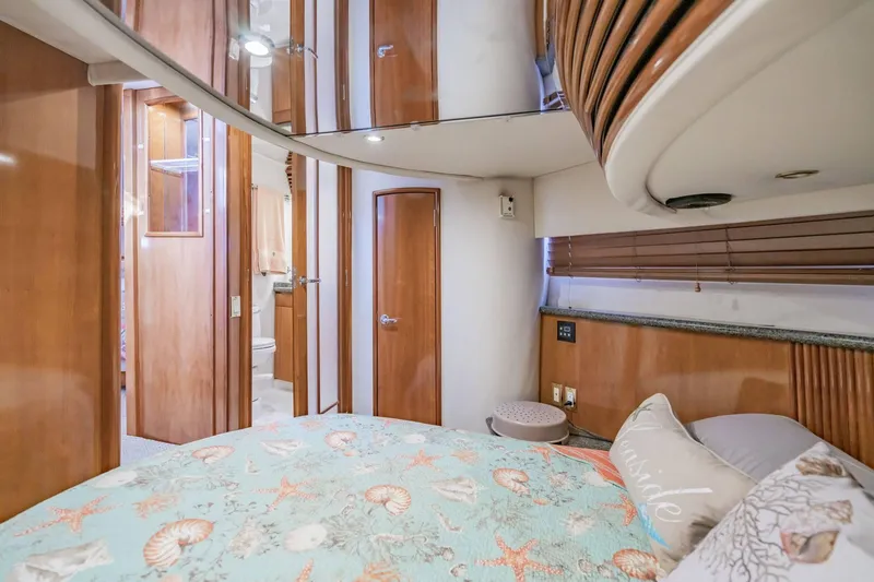 Slide: The Image of Interior of 2000 Carver 450 Voyager Pilothouse with cozy bedroom and wooden accents. - 62